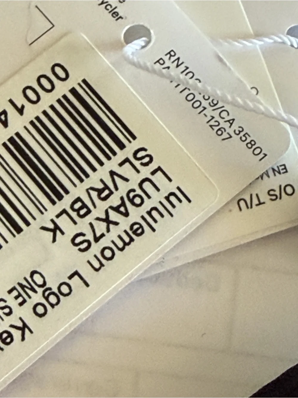 Lululemon Round Logo Keychain in Black and Silver